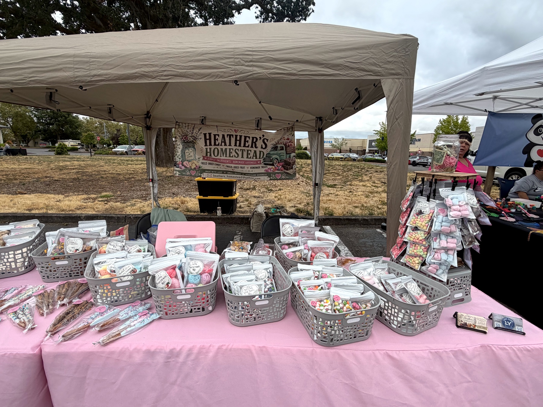 Bags of colourful candy and packaged treats arranged on Heather's market table